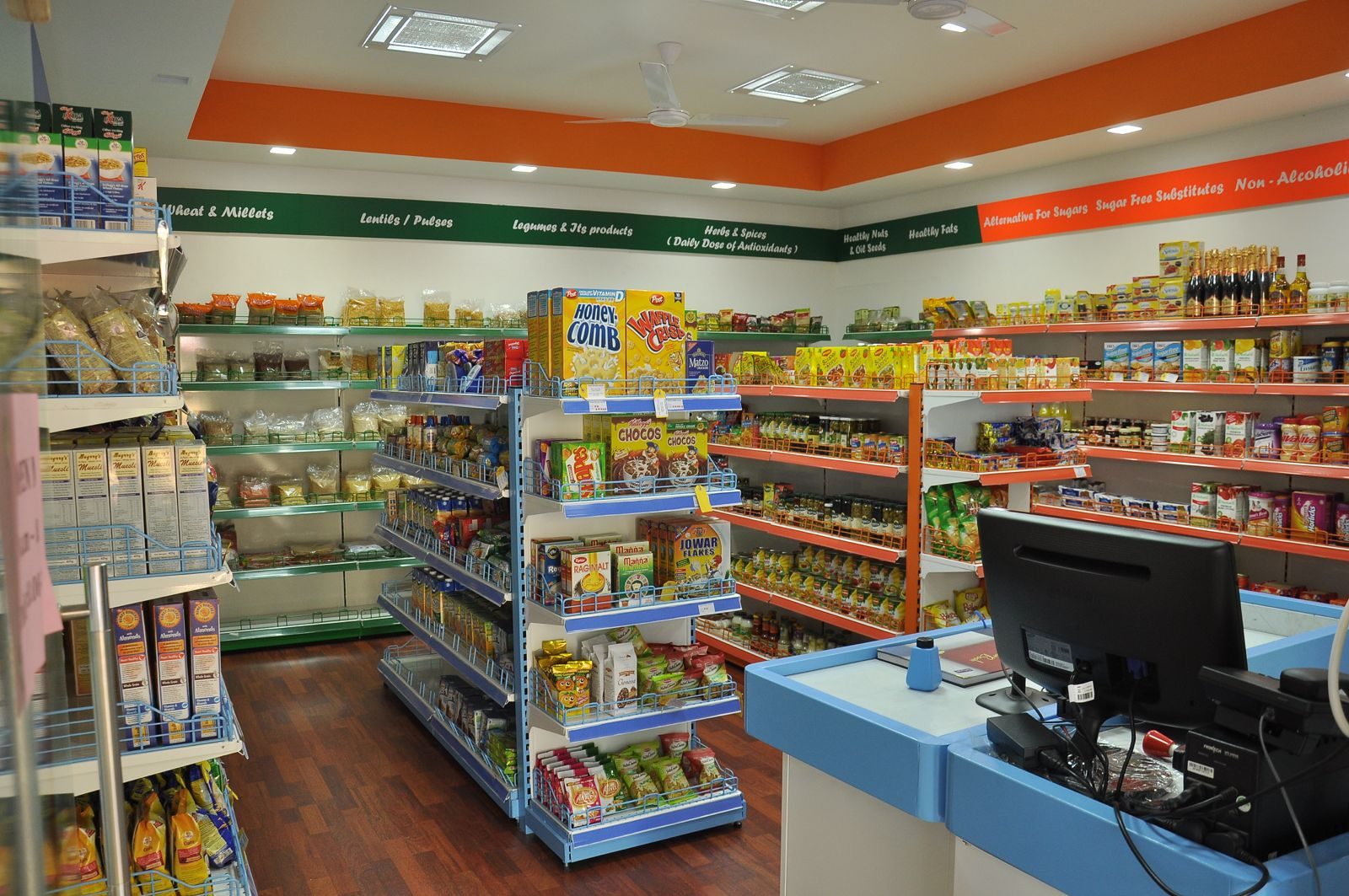 Healthy supermarket aisles with shelves for millets, pulses, legumes, herbs, nuts and healthy fats